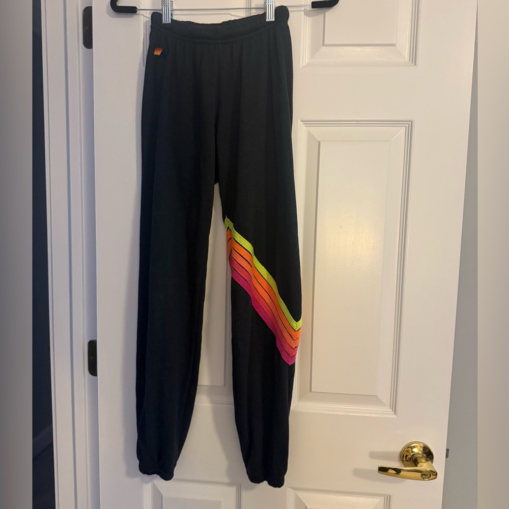 Aviator Nation. Black Joggers with Rainbow Neon Stripe